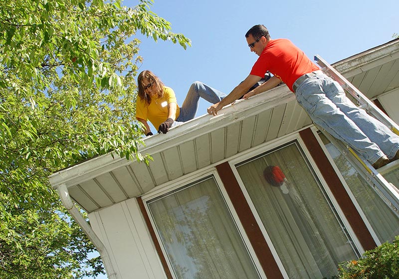 Unfastened Gutters Being Worked On